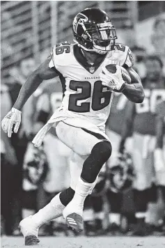  ?? AP FILE PHOTO/PHELAN M. EBENHACK ?? Atlanta Falcons running back Tevin Coleman runs against the Jacksonvil­le Jaguars on Aug. 25 in Jacksonvil­le, Fla. The Falcons will host the Carolina Panthers today in the NFC South opener for both teams.