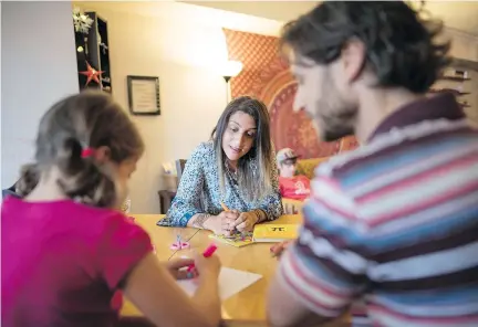  ?? J.P. MOCZULSKI/FOR POSTMEDIA NEWS ?? The Math Guru founder Vanessa Vakharia, centre, spends time with student Meira Tormey and tutor David Kochberg in her mid-town Toronto clinic. Increasing­ly, parents are turning to tutoring to make sure their children have an advantage over classmates.