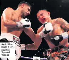  ??  ?? Amir Khan lands a left against Samuel Vargas