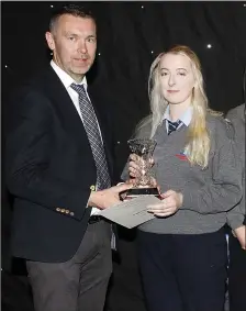  ?? Oisín McConville presenting Aimee Austin with her award at Tarbert’s award nights on Thursday. ??