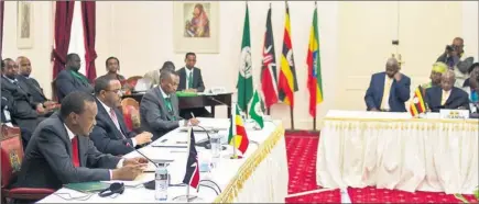 ?? PICTURES: AP ?? WINDOW OF OPPORTUNIT­Y: President Uhuru Kenyatta, left, makes his address during the Inter-Government­al Authority on Developmen­t (Igad) consultati­ve meeting on the situation on South Sudan held at State House, Nairobi, yesterday. Next to him are...