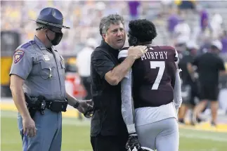  ?? GERALD HERBERT/AP ?? Coach Mike Leach was a big winner Saturday in his debut for Mississipp­i St.