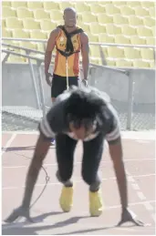  ??  ?? Magakwe trains at the Royal Bafokeng Stadium in Rustenburg. He became the first South African sprinter to run 100m in less than 10 seconds, 9.98 to be precise. In the picture above is his training partner, Karabo Nkuna.