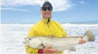  ??  ?? BIG CATCH: Adriaan Rossouw shows off a surf caught and tagged kob of 93cm at St Francis Bay