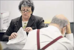  ?? Paul Buckowski / Times Union ?? Kathleen Donovan, counting ballots in a 2012 race, got the unanimous nod from the Albany County Democratic Committee to be the new Democratic Elections Commission­er. The legislatur­e must still confirm.