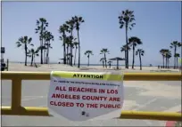  ?? MARCIO JOSE SANCHEZ — THE ASSOCIATED PRESS ?? A closure sign is placed at the entrance of a beach front parking lot on March 29, 2020, in the Venice beach section of Los Angeles.