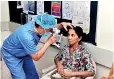  ??  ?? A Chinese eye surgeon inspecting a patient