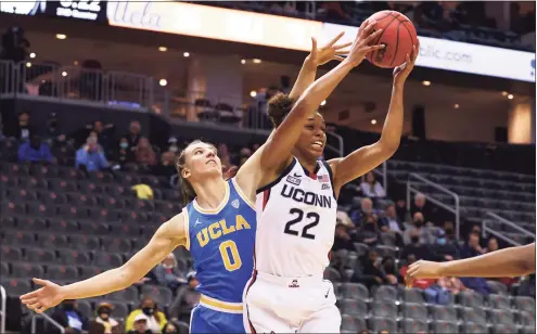  ?? Rich Schultz / Getty Images ?? UConn’s Evina Westbrook, right, says players have been frustrated while the squad has been reduced by injuries and COVID-19: “It sucks just for games getting canceled and obviously not being able to play. Just practice, practice, practice, and I think we’re just ready to play somebody else besides ourselves and our practice guys.”