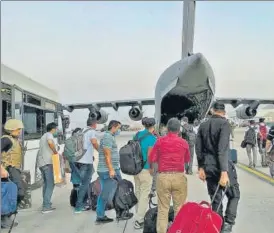  ?? AFP ?? Indian Nationals prepare to board an Indian military aircraft at the airport in Kabul on Tuesday after the Taliban stunning takeover of Afghanista­n.
