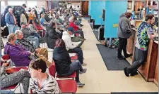  ?? SEAN D. ELLIOT/THE DAY ?? A crowd waits Tuesday at the DMV branch in Norwich.