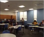  ??  ?? Students work quietly on Sept. 13 at the new Willoughby South High School. The classroom’s tables can be combined (in pairs) to form circular tables.