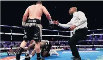  ?? PHOTO: GETTY IMAGES ?? Too late . . . New Zealander Joseph Parker stands over Dillian White after knocking him down in the 12th round of their heavyweigh­t contest in London on Sunday.