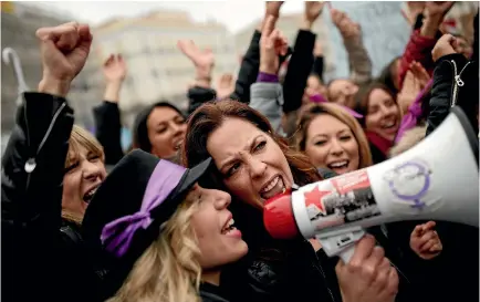  ?? PHOTO: AP ?? People, mostly women, shout slogans during a protest at the Puerta del Sol square in Madrid to mark Internatio­nal Women’s Day.