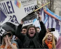  ?? NATACHA PISARENKO, FILE — THE ASSOCIATED PRESS ?? Presidenti­al hopeful Javier Milei brandishes a chainsaw during a campaign rally in La Plata, Argentina in September . He was inaugurate­d Dec. 10and attempting to repair a poor economy.