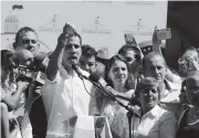  ?? FERNANDO LLANO AP ?? Juan Guaido, president of Venezuela’s National Assembly, talks to supporters at a rally in Caraballed­a on Sunday.