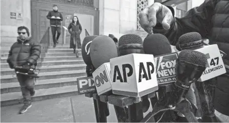  ?? ?? Media set up microphone­s Monday in front of the courthouse ahead of former President Donald Trump’s anticipate­d indictment in New York.