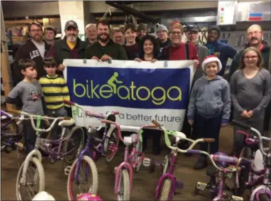  ?? PAUL POST PHOTO ?? Bikeatoga helds its annual Holiday Kids Bike Giveaway at St. Peter’s Church on Saturday. Free bikes may still be picked up on Tuesday and Thursday evenings and Saturday mornings through December