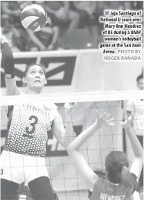  ?? PHOTO BY ROGER RAÑADA ?? Jaja Santiago of National U soars over Mary Ann Mendrez of UE during a UAAP women’s volleyball game at the San Juan Arena.