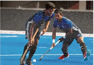  ??  ?? Hard at work: Malaysian players Faizal Saari (left) and Muhd Razie Abdul Rahim training at the Kalinga Stadium to prepare for their cruncher against Pakistan today.