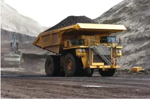  ?? Associated Press ?? ■ A truck hauls coal April 4, 2013, at Cloud Peak Energy's Spring Creek strip mine near Decker, Mont. The Trump administra­tion is considerin­g using West Coast military bases or other federal properties as transit points for shipments of U.S. coal and natural gas to Asia.