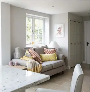  ??  ?? Above: In the cosy seating area is a sofa from John Lewis & Partners. The lamp is from Neptune, cushions from Vanessa Arbuthnott and the throw is from Homesense