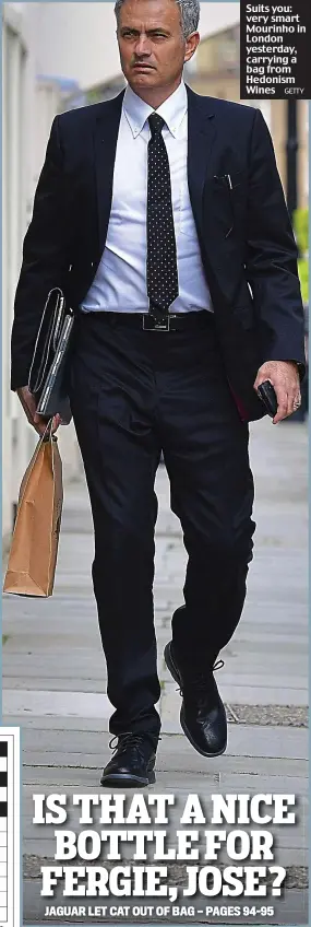  ?? GETTY ?? Suits you: very smart Mourinho in London yesterday, carrying a bag from Hedonism Wines