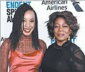  ?? AMANDA EDWARDS/GETTY ?? Chinonye Chukwu, left, poses with Alfre Woodard, who stars as a conflicted prison warden in “Clemency.”