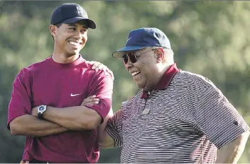  ?? DOUG BENC/GETTY IMAGES/FILES ?? An ESPN magazine story from a year ago detailed Tiger Woods’ zeal for U.S. navy SEAL training, raising questions about how deeply the former world No. 1 was shaken by the 2006 death of his father Earl Woods, right, himself a former military man.