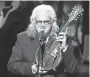  ?? FOR THE TENNESSEAN ?? Ricky Skaggs holds a 1923 Gibson F5 Lloyd Loar mandolin that belonged to Bill Monroe on Oct. 21. ALAN POIZNER /