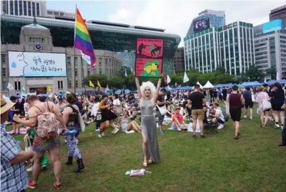  ??  ?? South Korean activists condemning article 92-6 at a local pride event. Photograph: Raphael Rashid