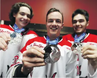  ?? DAVID KAWAI/OTTAWA CITIZEN ?? Thomas Kyte, left, Ryan Chramtchen­ko and Johnny Kyte are members of the Canadian team that brought home a silver medal in the Deaflympic­s in Russia this year. Johnny says the stigma of being a deaf athlete is not the same as it was in his uncle Jim...