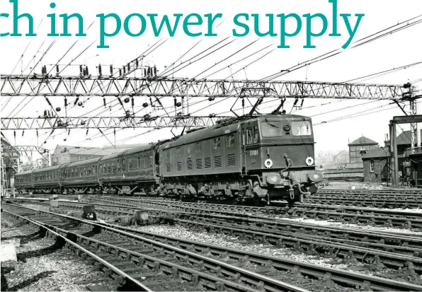  ?? AEI. ?? The large bulk of 1954-built DC 77004 is evident in this view at Manchester Piccadilly of a Sheffieldb­ound train. Note also the substantia­l overhead line supports.