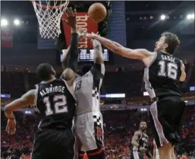  ?? ERIC CHRISTIAN SMITH — THE ASSOCIATED PRESS ?? San Antonio Spurs center Pau Gasol (16) blocks the shot of Houston Rockets guard James Harden (13) as forward LaMarcus Aldridge defends during the second half in Game 6 of an NBA basketball second-round playoff series, Thursday in Houston. San Antonio...
