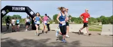  ?? ?? Runners competing in the 10- and 16-kilometre distances sprint away from the starting line at the 2022 Southwest Run for Shelter, June 11.