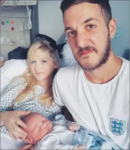  ?? AP PHOTO ?? Chris Gard and Connie Yates with their son Charlie Gard at Great Ormond Street Hospital in London.