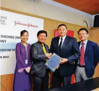  ??  ?? (From left): Dr April Camilla Roslani, Dr Hanafiah Harunarash­id, Chin Keat Chyuan and Yeoh Boon Hock at the MOU signing ceremony.