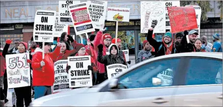  ?? ANTONIO PEREZ/CHICAGO TRIBUNE ?? Teachers and supporters rally outside Simeon Career Academy in Chicago during the first day of the strike — Oct. 17.