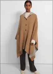  ?? COURTESY THEORY.COM ?? TOP THINGS OFF: Button up in Theory’s Hooded Poncho in felted wool-cashmere in soft oatmeal/camel.