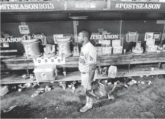  ?? AP ?? Dodgers outfielder Yasiel Puig walks in the dugout after Game 6 of the National League Championsh­ip Series against the Cardinals on Friday in St. Louis. The 9-0 loss ended the Dodgers’ season.