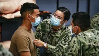  ?? Billy Calzada / Staff file photo ?? Navy personnel train to be corpsmen at Joint Base San Antonio-Fort Sam Houston in August. The Navy says 88 percent of active-duty personnel are fully immunized against COVID-19.