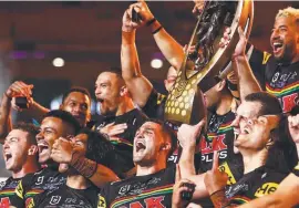  ?? ?? The Panthers celebrate with the NRL Premiershi­p Trophy. Getty Images