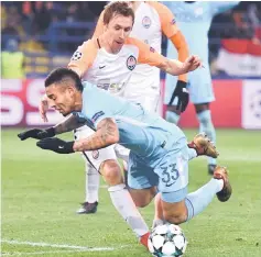  ??  ?? Shakhtar Donetsk’s Bohdan Butko fouls Manchester City’s Gabriel Jesus and concedes a penalty during the UEFA Champions League group F match at the Metalist stadium in Kharkiv, Eastern Ukraine. — AFP photo