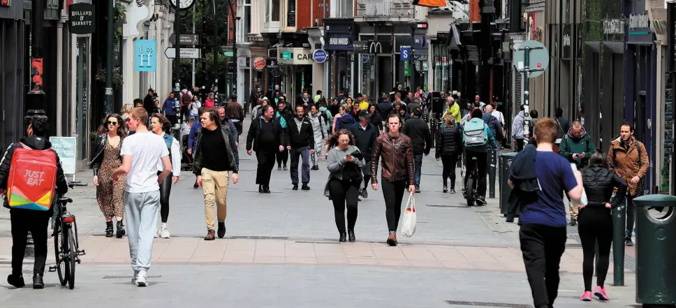  ??  ?? MOVING ON: People on Dublin’s Grafton Street yesterday afternoon as Ireland moves through the phases easing restrictio­ns put in place as a result of the coronaviru­s pandemic. Photo: Brian Lawless