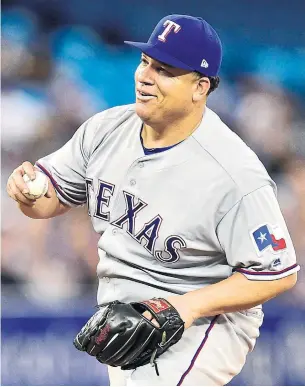  ?? FRANK GUNN/THE CANADIAN PRESS ?? Rangers starter Bartolo Colon snagged a sharp line drive to the mound off the bat of Blue Jay Kevin Pillar, who expected a better result on a day when solid contact was hard to come by.