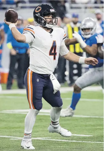  ?? DAVE REGINEK/GETTY IMAGES ?? Chase Daniel of the Chicago Bears looks to make a pass Thursday during the U.S. Thanksgivi­ng Day game against the Detroit Lions at Ford Field. Daniel guided the Bears to a 23-16 win.
