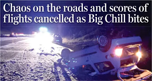  ??  ?? Treacherou­s: A flipped car on the snow-covered M20 in Kent. The picture was tweeted by police to warn other drivers