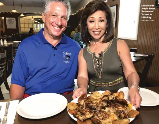  ?? SUN- TIMES STAFF ?? Linda Yu with Joey Di Bouno, the owner of Tufano’s in Little Italy.