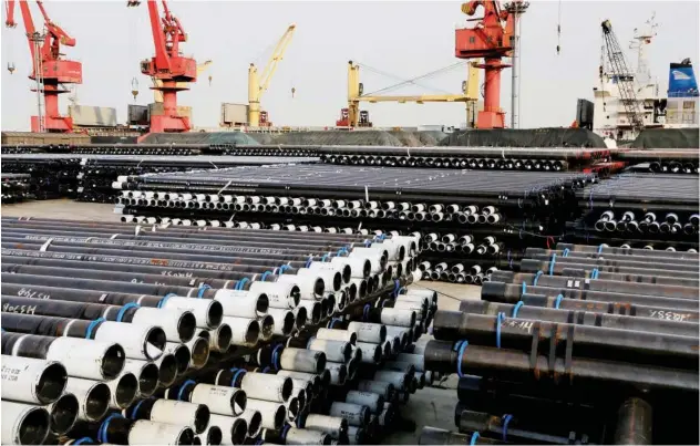  ?? Reuters ?? Steel pipes for exports at a port in Lianyungan­g, China.