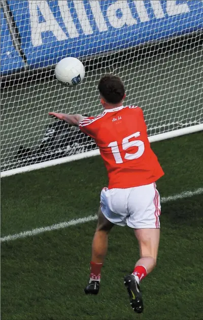  ??  ?? Laois’ Robbie Piggott arrives too late to prevent Louth’s Ryan Burns from palming to an empty net at Croke Park o