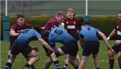  ?? ?? Matthew Graham is tackled during Enniskille­n’s All Ireland Junior Cup quarter final victory over Kilfeacle and District in Tipperary on Saturday.